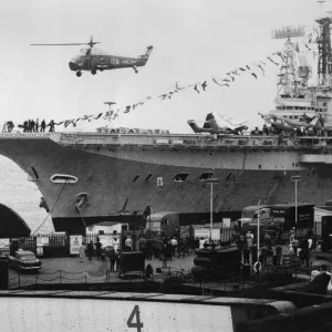 A helicopter taking off from the aircraft carrier HMS Centaur