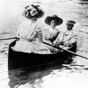 Henley Regatta. Man and two ladies boating on the river Henley Regatta. Man and two ladies boating on the river
