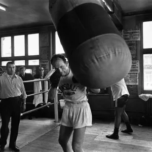 Henry Cooper in the gym training ahead of his second with Muhammad Ali Henry Cooper in the gym training ahead of his second with Muhammad Ali