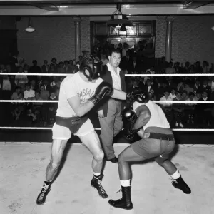 Henry Cooper seen here (left) in training at The Bellingham for his fight against Cassius Henry Cooper seen here (left) in training at The Bellingham for his fight against Cassius