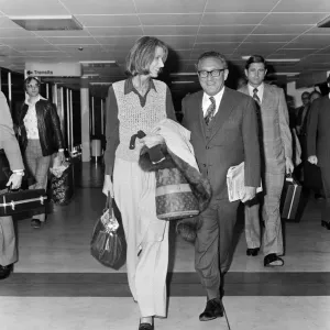 Henry Kissinger and his wife Nancy at London airport. 23rd April 1977