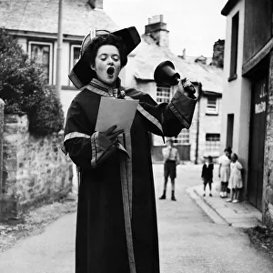 Heres the town crier - a 1943 version - the girl on the crier
