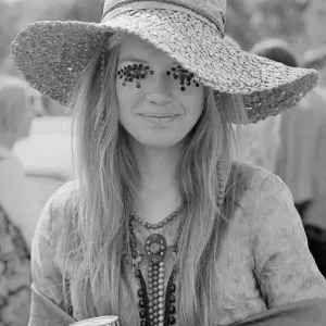 A Hippy lady with large hat and eye make up at the free Rolling Stones concert in Hyde A Hippy lady with large hat and eye make up at the free Rolling Stones concert in Hyde