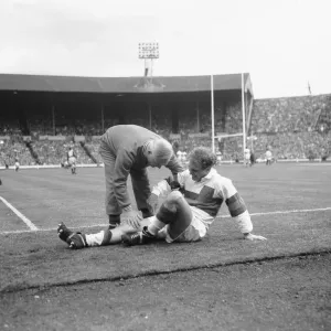 Hirst of Wakefield Trinity seen here gets treatment for a injury leg during the Rugby Hirst of Wakefield Trinity seen here gets treatment for a injury leg during the Rugby