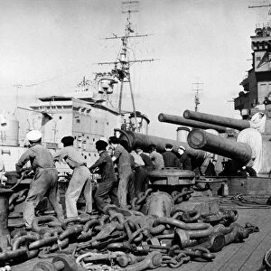HMS Warspite A line of sailors hauling up stores on the fore deck