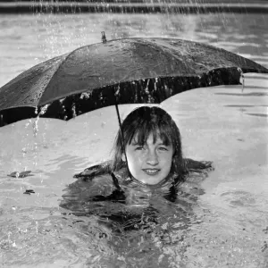 This holiday maker is determined to make the best of her holiday whatever the weather