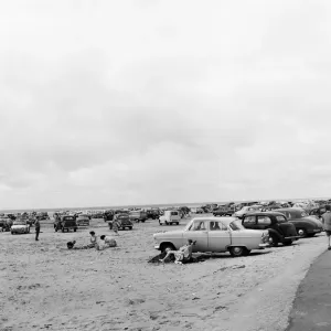 Holiday makers and their cars on Southport beach, Merseyside. 5th August 1959 Holiday makers and their cars on Southport beach, Merseyside. 5th August 1959