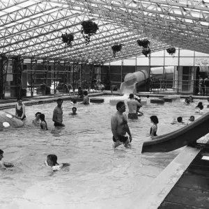 Holiday makers enjoy the Swimming Pool at the Sun Centre, Trecco Bay, Porthcawl, Bridgend Holiday makers enjoy the Swimming Pool at the Sun Centre, Trecco Bay, Porthcawl, Bridgend