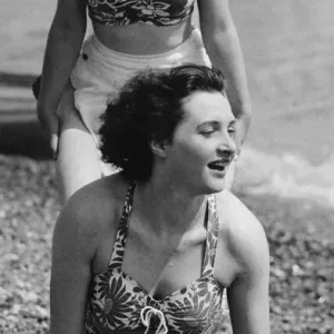 Holidaymakers play a wheelbarrow race on the pebble beach at Hastings May 1947 Holidaymakers play a wheelbarrow race on the pebble beach at Hastings May 1947