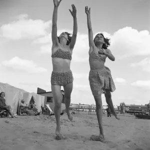 Holidaymakers playing with a quoit on the beach close to the Britannia Pier Holidaymakers playing with a quoit on the beach close to the Britannia Pier