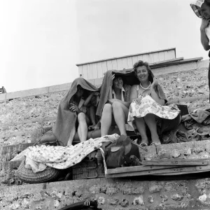 Holidaymakers in the rain at Hove, East Sussex. 1st July 1961 Holidaymakers in the rain at Hove, East Sussex. 1st July 1961