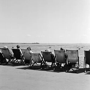 Holidaymakers relax in their deckchairs for a spot of sunbathing on the beach at Southend