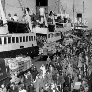 Holidaymakers returning from the Isle of Man make their way along Liverpool landing stage Holidaymakers returning from the Isle of Man make their way along Liverpool landing stage