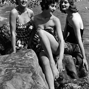 Holidays: Three bathing beauties seen here sunbathing on a Devon beach. July 1958 P013217
