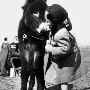 Holidays - Children with Animals Donkey Dorothy 4 Years old with a young Donkey Holidays - Children with Animals Donkey Dorothy 4 Years old with a young Donkey