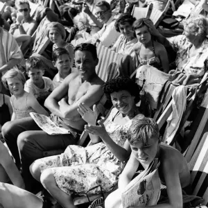 Holidays: Holiday makers Sunbathing whilst watching the Minor Beach Fashion Show Holidays: Holiday makers Sunbathing whilst watching the Minor Beach Fashion Show