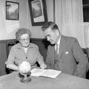 Holidays: Pensioners seen here looking at the globe deciding where to go to for their Holidays: Pensioners seen here looking at the globe deciding where to go to for their