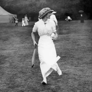 Holland House Fete. Woman cricketer Mrs Solomon batting. July 1913 Holland House Fete. Woman cricketer Mrs Solomon batting. July 1913