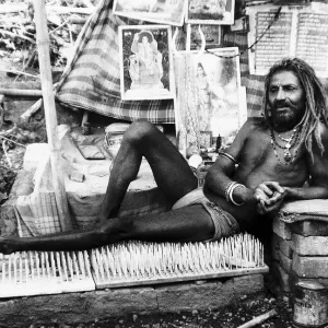 Holy man Kante Wala Baba who has taken a vow of silence on his bed of nails in Rishikesh Holy man Kante Wala Baba who has taken a vow of silence on his bed of nails in Rishikesh