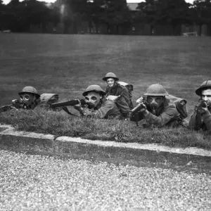 Home Guard taking rifle practice during a mock gas attack. Circa 1941 Home Guard taking rifle practice during a mock gas attack. Circa 1941
