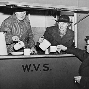 Home Secretary Herbert Morrison seen here being served with a cup of tea by W. V. S