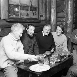 Home Secretary James Callaghan having a drink with the some members of a climbing team