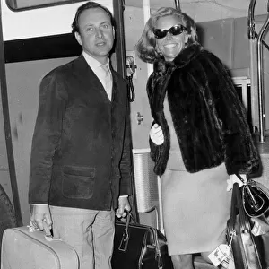 Honor Blackman and David Jacobs at London airport - May 1966 -----