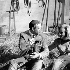 Honor Blackman and Sean Connery in haystack during filming of Goldfinger - June 1964