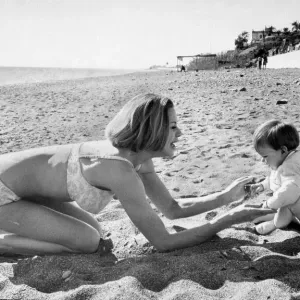 Honor Blackman Print - Bikini-clad Actress on Beach with Daughter
