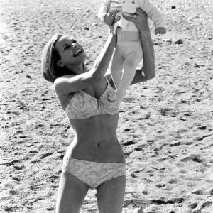 Honor Blackman wearing biini playing with daugher Lottie on beach in Spain during filming Honor Blackman wearing biini playing with daugher Lottie on beach in Spain during filming