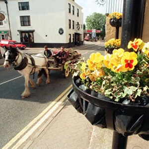 A horse and cart makes it way along Shipston-on-Stour High Street, Warwickshire