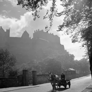 Horse and cart pass through peaceful countryside village Cobbled street Edinburgh Horse and cart pass through peaceful countryside village Cobbled street Edinburgh