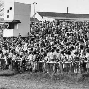 Horses and jockeys trot to the start watched by anxious race-goers at Hexham Racecourse Horses and jockeys trot to the start watched by anxious race-goers at Hexham Racecourse