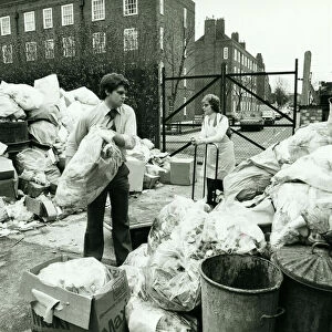 Hospital Staff clear away rubbish at the Queen Elizabeth Childrens Hospital in Hackney