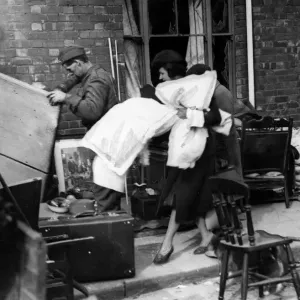 Householders salvage goods from a bombed area in Cardiff following a German air raid Householders salvage goods from a bombed area in Cardiff following a German air raid
