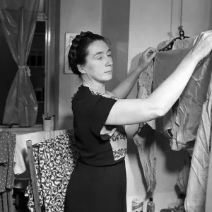 Housewives Washing Controversy Woman hanging up clothes to dry in her North