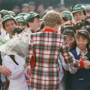 HRH Princess Diana, The Princess of Wales with workers at the Honda factory in Tokyo HRH Princess Diana, The Princess of Wales with workers at the Honda factory in Tokyo