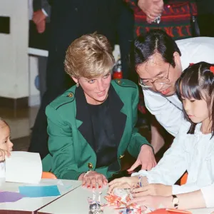 HRH Princess Diana, The Princess of Wales with workers at the Honda factory in Tokyo HRH Princess Diana, The Princess of Wales with workers at the Honda factory in Tokyo