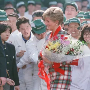 HRH Princess Diana, The Princess of Wales with workers at the Honda factory in Tokyo HRH Princess Diana, The Princess of Wales with workers at the Honda factory in Tokyo