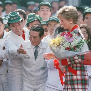 HRH Princess Diana, The Princess of Wales with workers at the Honda factory in Tokyo HRH Princess Diana, The Princess of Wales with workers at the Honda factory in Tokyo