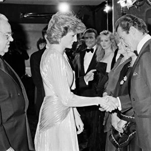 HRH The Princess of Wales, Princess Diana greets lead actor Roger Moore at The Royal