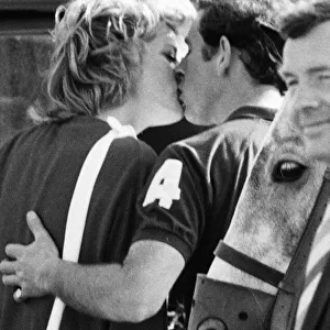 HRH The Princess of Wales, Princess Diana and Prince Charles have an affectionate kiss at