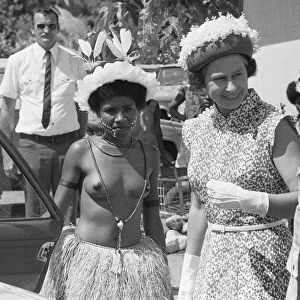 HRH Queen Elizabeth II seen here being greeted by official in Western Samoa during her