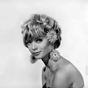 hristmas Earrings: Uschi Bernell modelling Christmas design earrings. 1965 D178-002