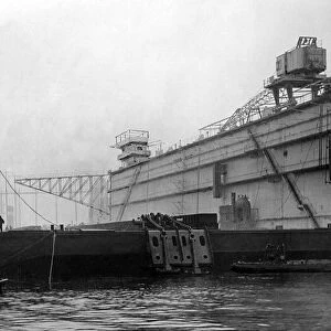 The huge Singapore Dock, the first section of which will leave the River Tyne to be towed