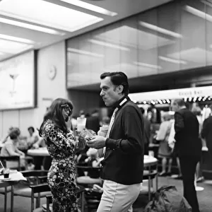 Hugh Hefner pictured with his girlfriend Barbi Benton at the airport. 6th September 1969