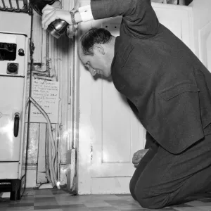 Humour: The Rev Brian Bason shoe in hand prepares to make a kill in his battle with