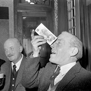 Humour / Unusual. John Mitchell balancing a pound note. February 1975 75-00662-002