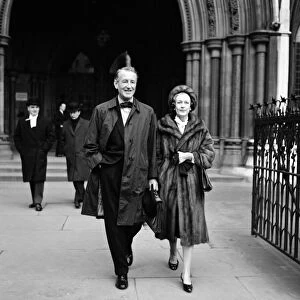 Ian Fleming, creator of James Bond, and his wife outside court for the