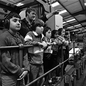 Ian Kenworthy shows the Examiner press centre to children from Stile Common Junior School